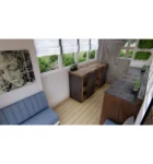 Container-maritime-de-20-pieds-utilise-comme-abri-de-jardin-avec-une-peinture-verte-integree-dans-un-espace-paysager-600×641-1
