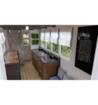 Container-maritime-de-20-pieds-utilise-comme-abri-de-jardin-avec-une-peinture-verte-integree-dans-un-espace-paysager-600×641-1